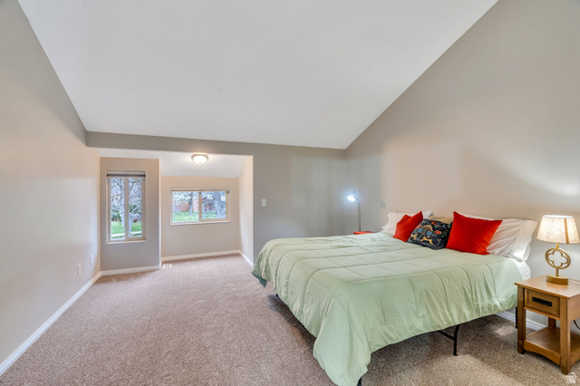 3221 North Shadowbrook Circle Provo, UT 84604 - Photo 10 of 29 Bedroom with light carpet and vaulted ceiling