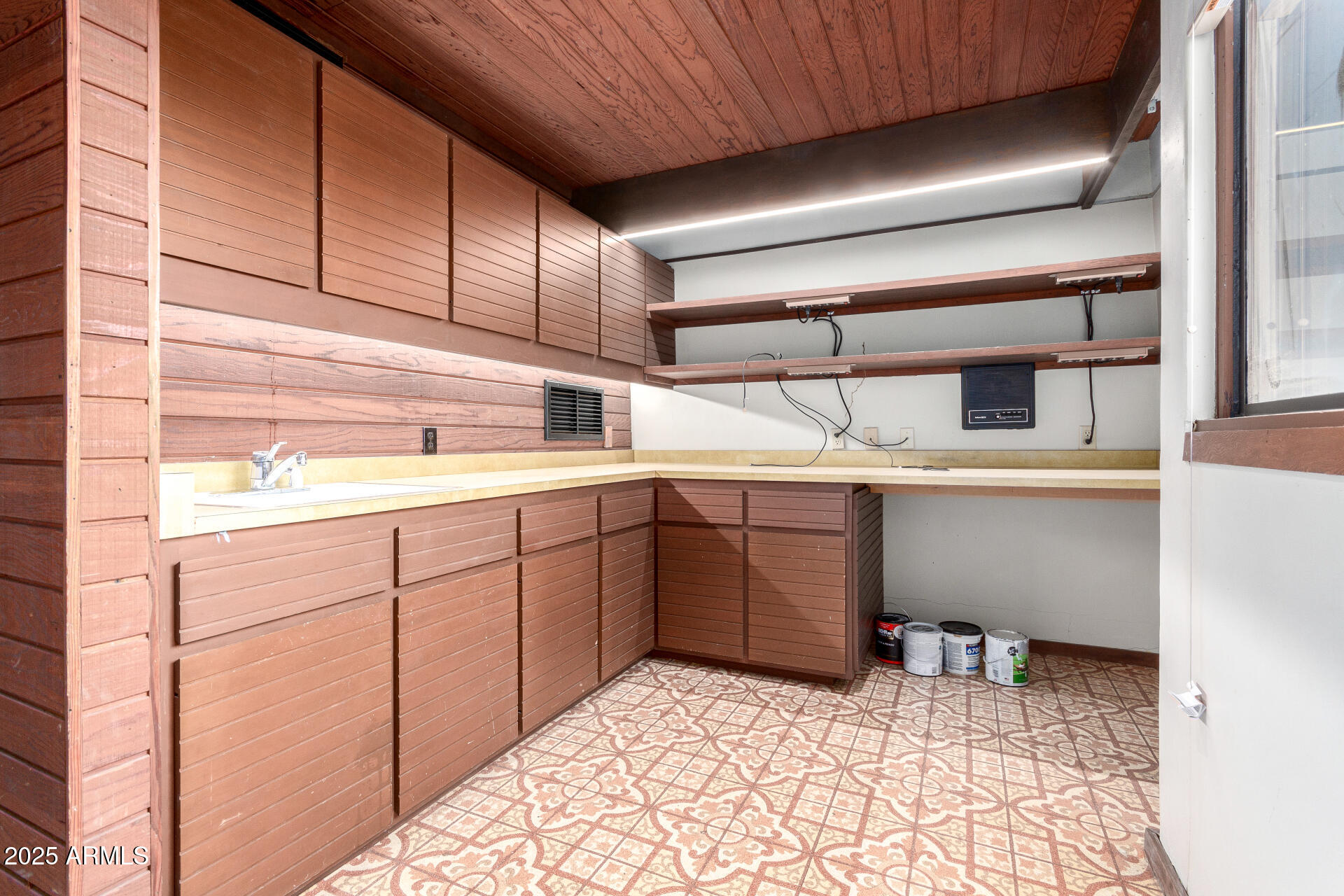 5275 North Camelhead Road Phoenix, AZ 85251 - Photo 39 of 72 a kitchen with a sink and cabinets