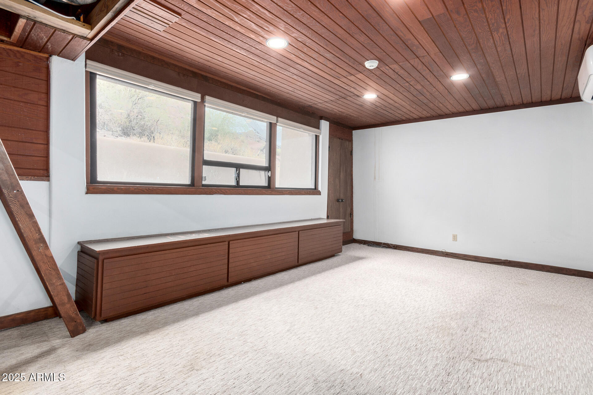 5275 North Camelhead Road Phoenix, AZ 85251 - Photo 40 of 72 a view of an empty room with a window