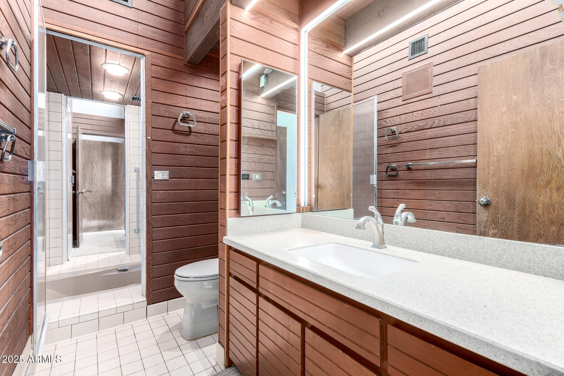 5275 North Camelhead Road Phoenix, AZ 85251 - Photo 51 of 72 a bathroom with a sink a toilet and shower