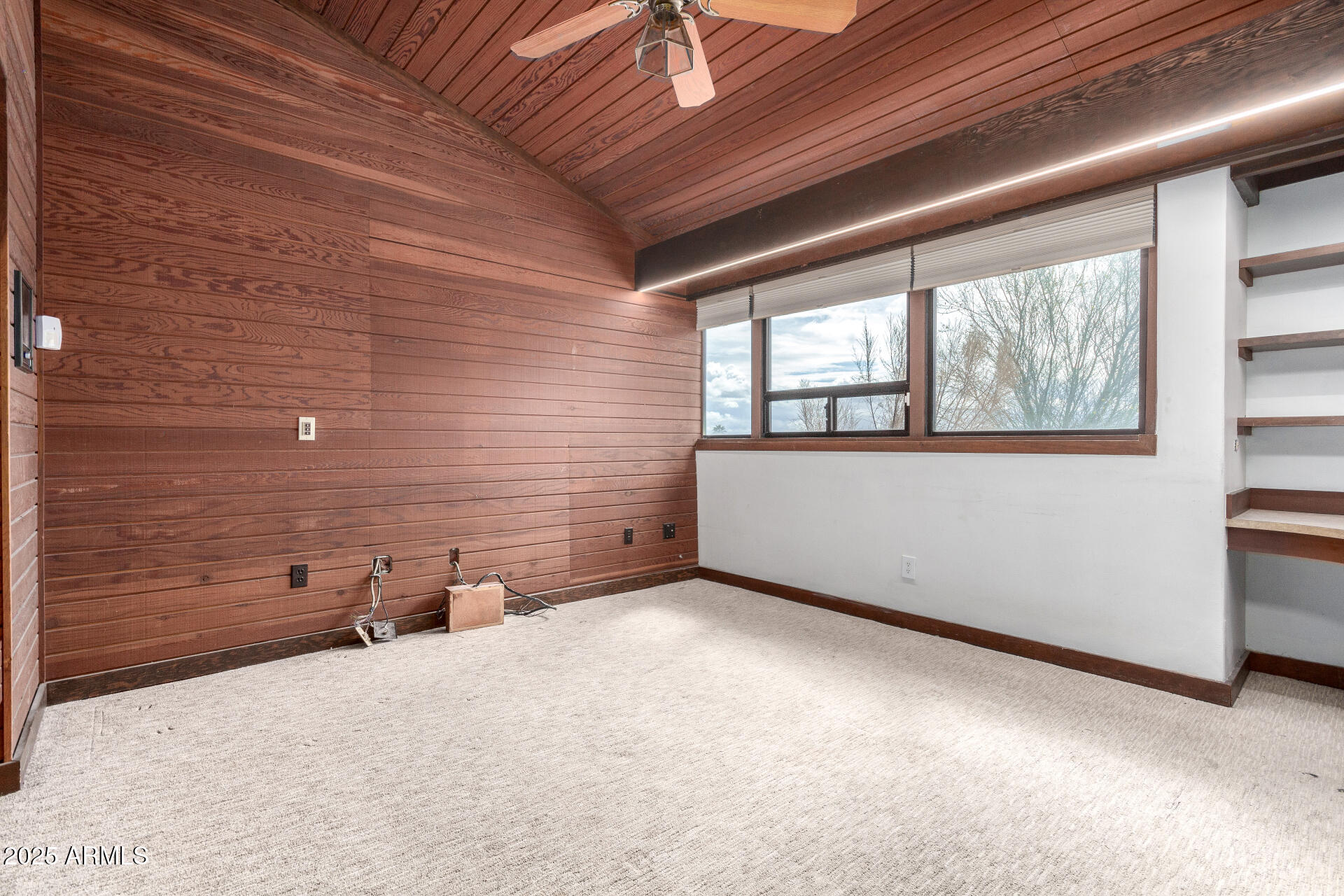 5275 North Camelhead Road Phoenix, AZ 85251 - Photo 52 of 72 a view of a livingroom with an empty space and a window