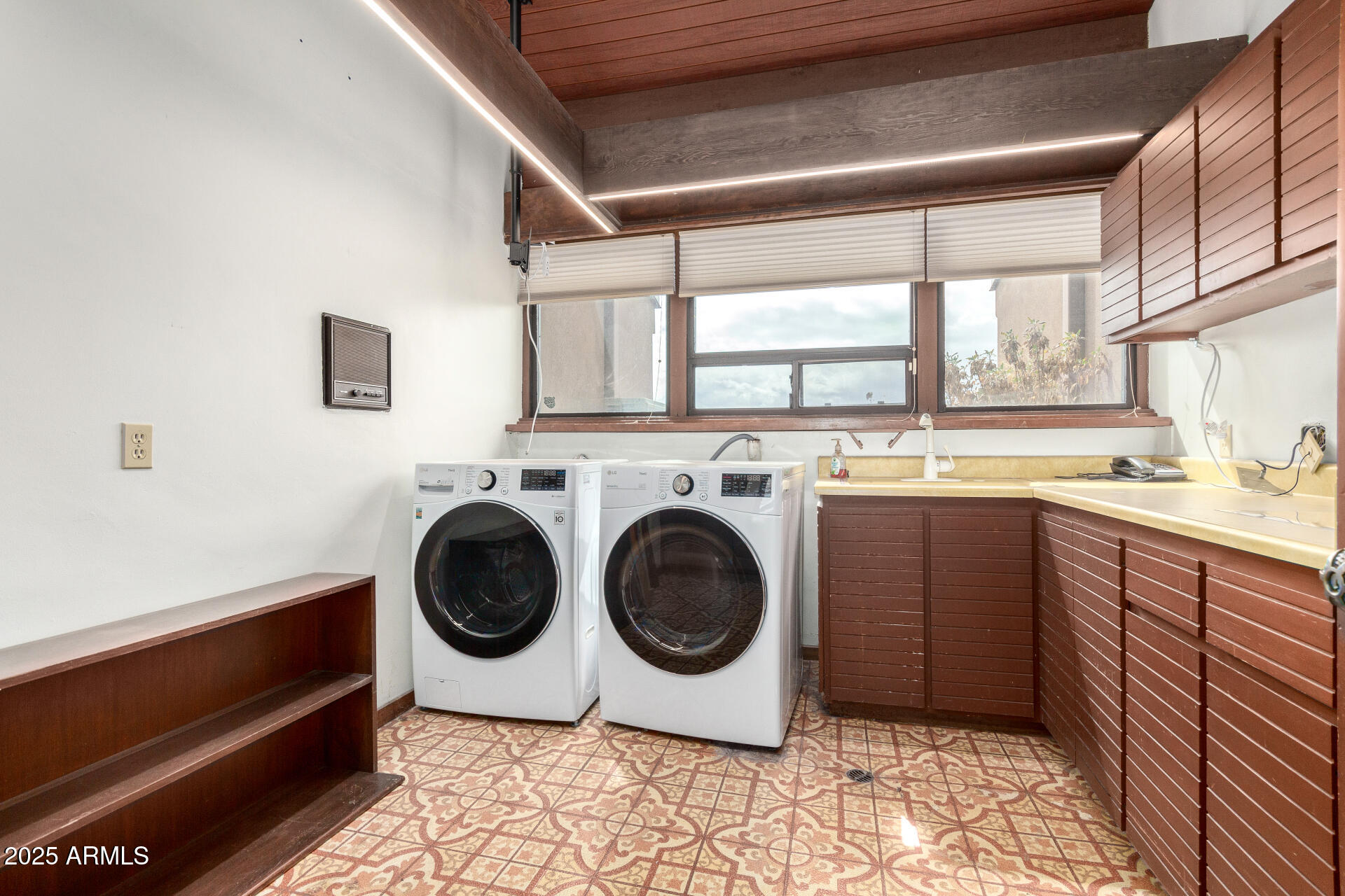 5275 North Camelhead Road Phoenix, AZ 85251 - Photo 55 of 72 a utility room with sink dryer and washer
