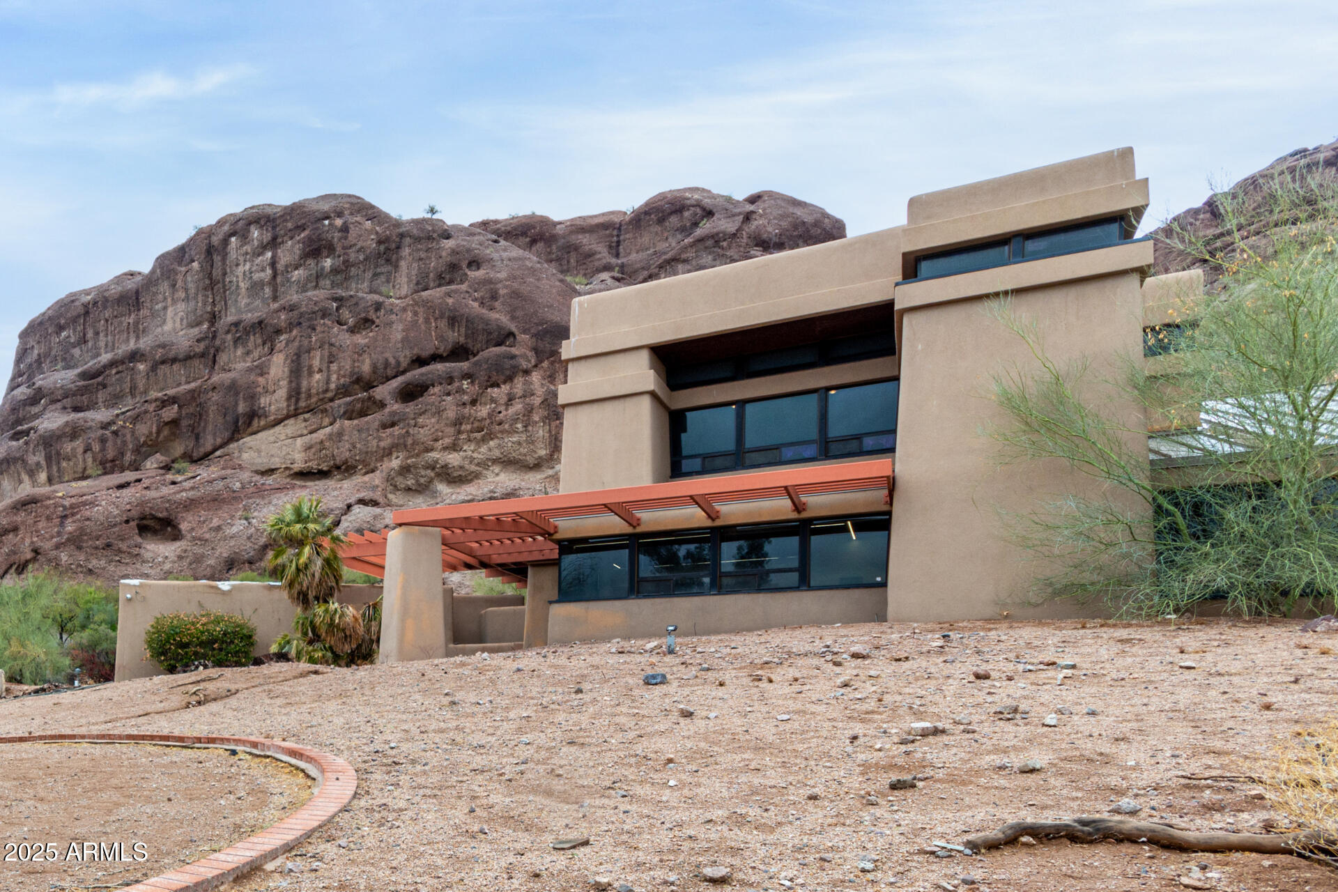5275 North Camelhead Road Phoenix, AZ 85251 - Photo 7 of 72 a front view of a house with a yard