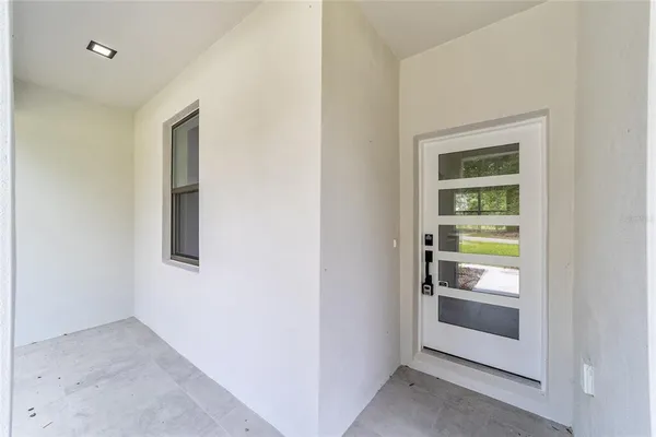 a room with a door and a hallway