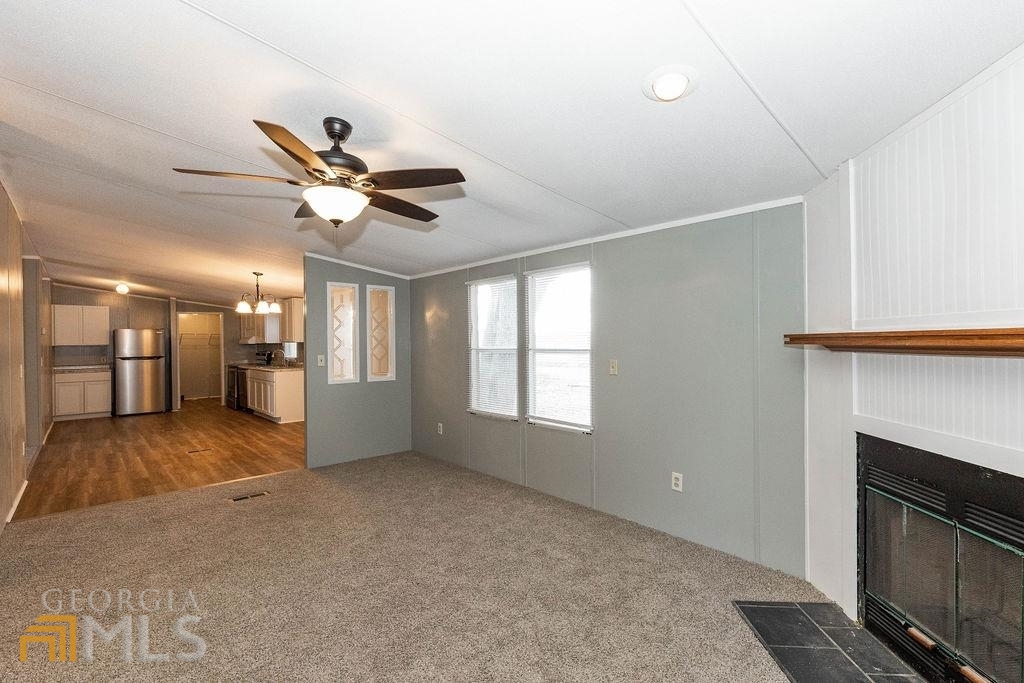 108 Sherwood Road Rincon, GA 31326 - Photo 13 of 28 a view of a livingroom with a ceiling fan and window