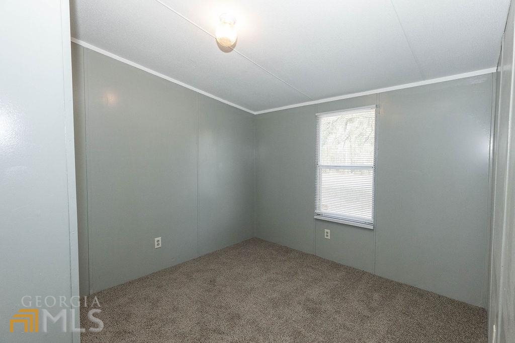 108 Sherwood Road Rincon, GA 31326 - Photo 17 of 28 an empty room with windows