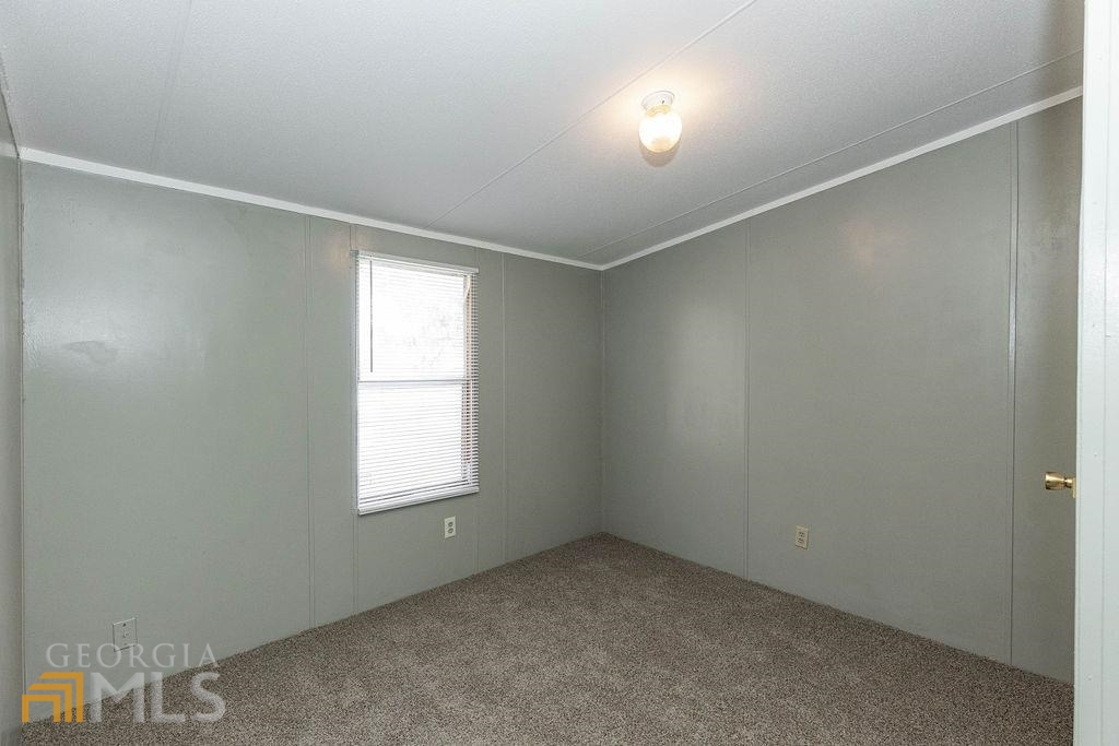 108 Sherwood Road Rincon, GA 31326 - Photo 19 of 28 an empty room with windows