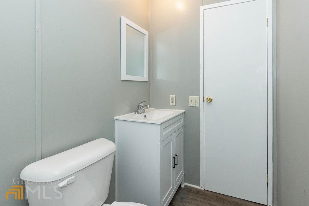 108 Sherwood Road Rincon, GA 31326 - Photo 28 of 28 a bathroom with a toilet sink and mirror