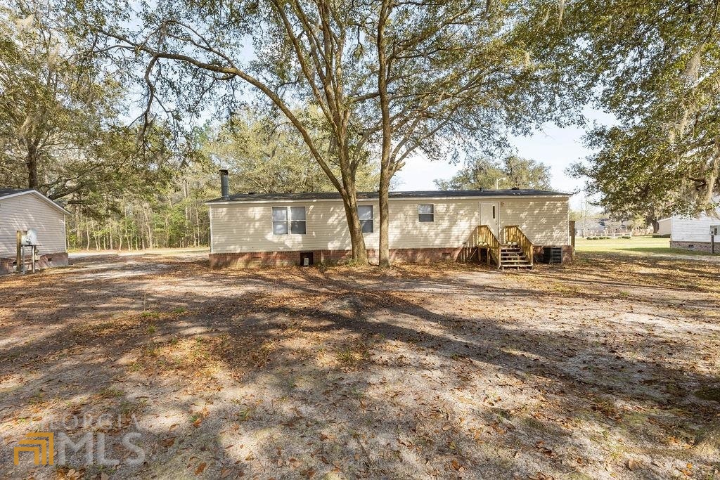 108 Sherwood Road Rincon, GA 31326 - Photo 6 of 28 a view of backyard of house with green space