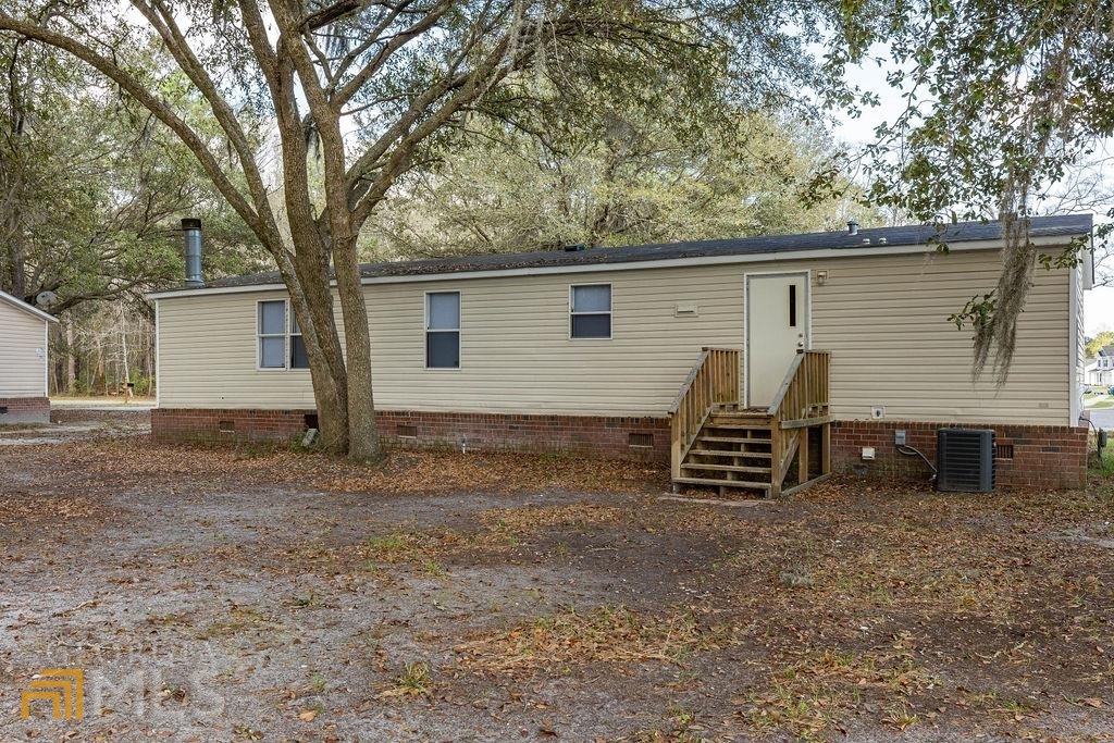 108 Sherwood Road Rincon, GA 31326 - Photo 9 of 28 a view of a house with a yard