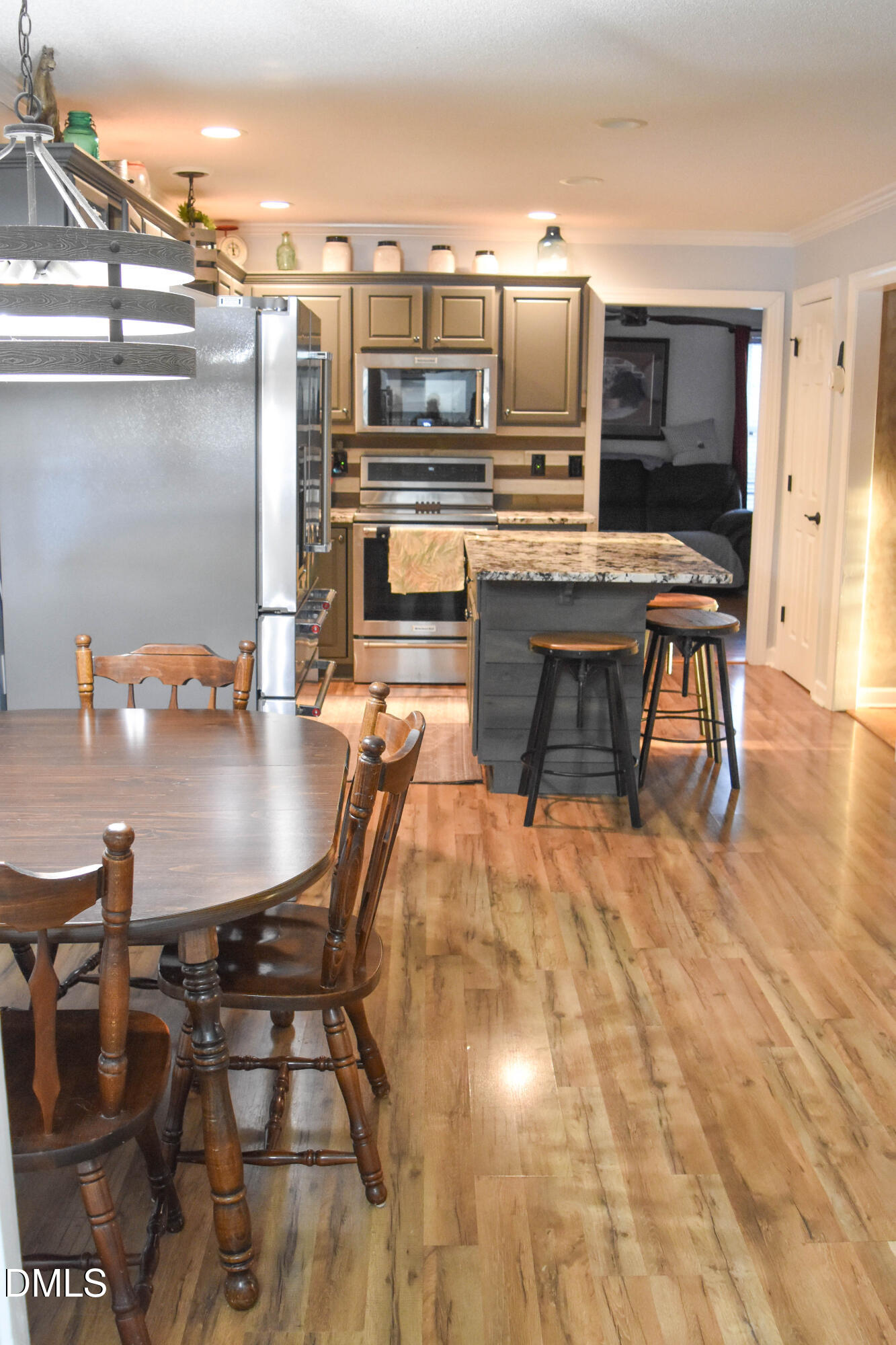 5908 Deep Spring Circle Wake Forest, NC 27587 - Photo 9 of 51 a dining room with furniture and wooden floor