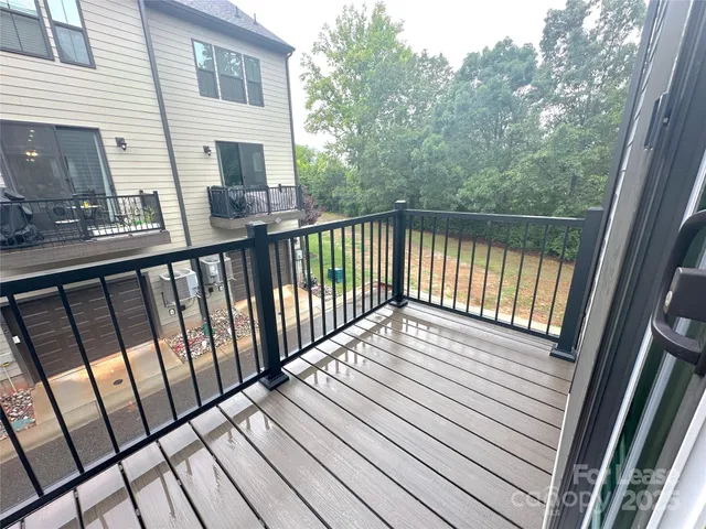 a view of balcony with wooden floor