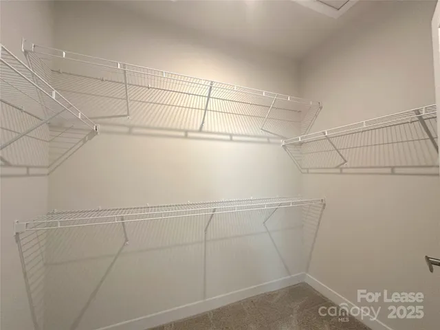 a view of a room with racks on the wall