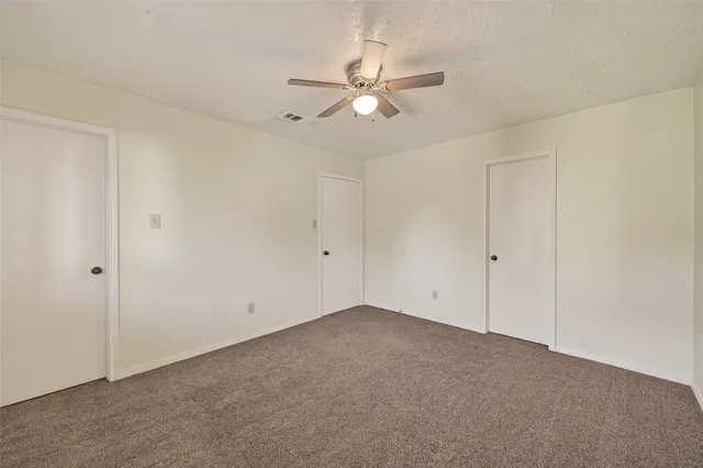 a view of room with window and walk in closet