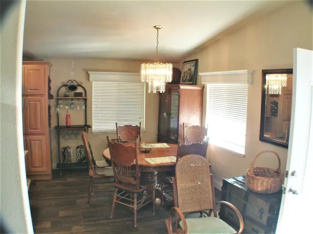 a dining room with furniture and window