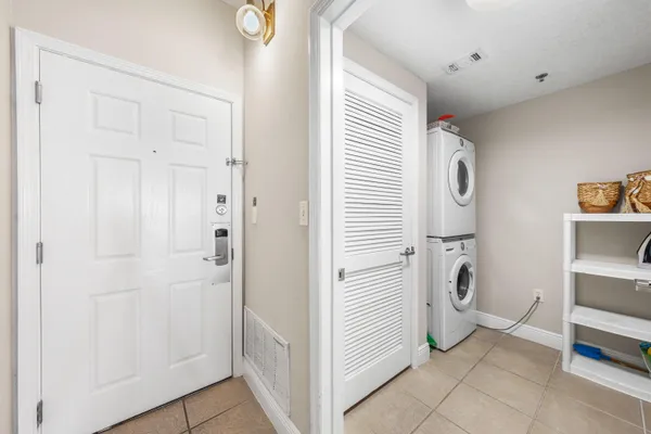 a kitchen with stainless steel appliances a stove sink and microwave