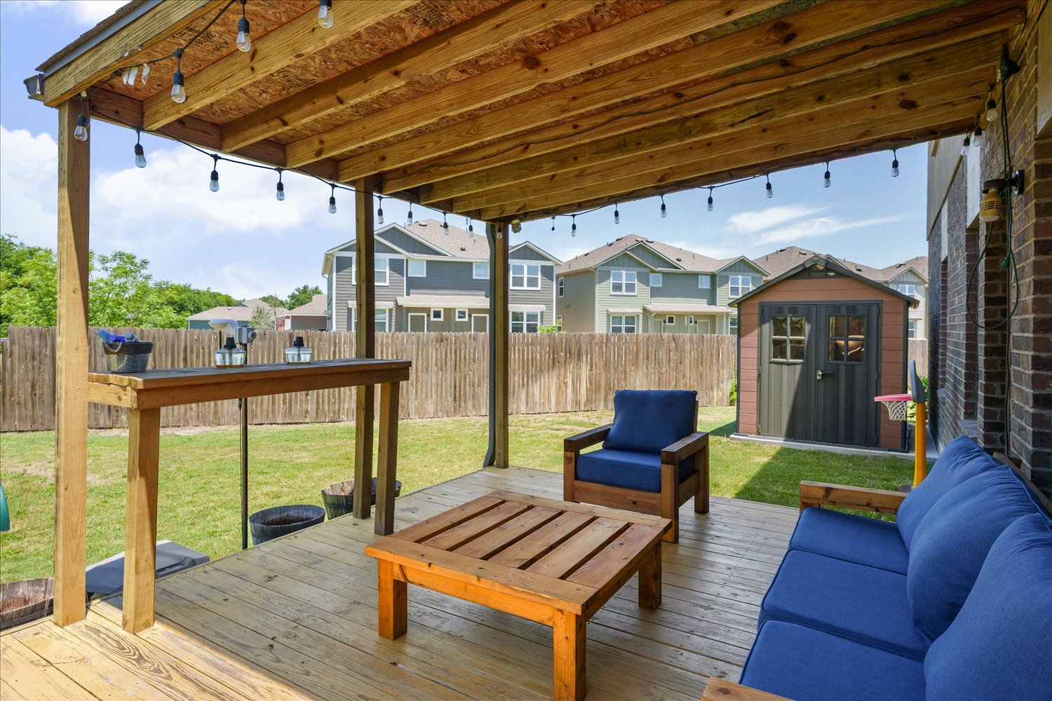 717 Kaluga Trail Leander, TX 78641 - Photo 26 of 40 a outdoor living space with furniture and a garden