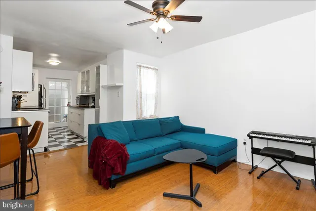 a living room with furniture and a rug