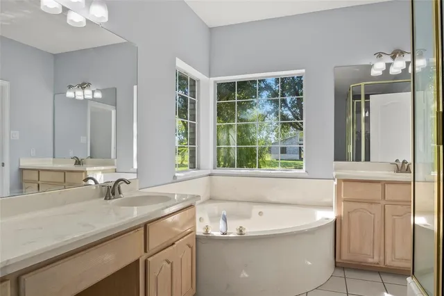 a bathroom with a granite countertop toilet and a shower