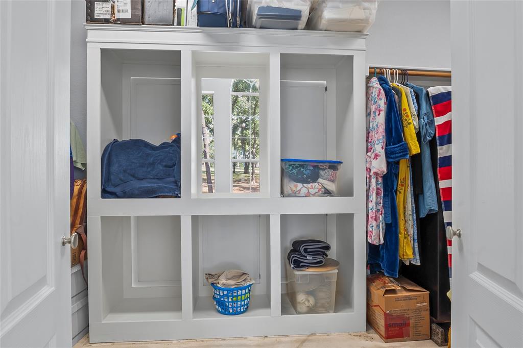 1082 Post Oak Road Copper Canyon, TX 76226 - Photo 20 of 40 a view of walk in closet with clothes and shoes