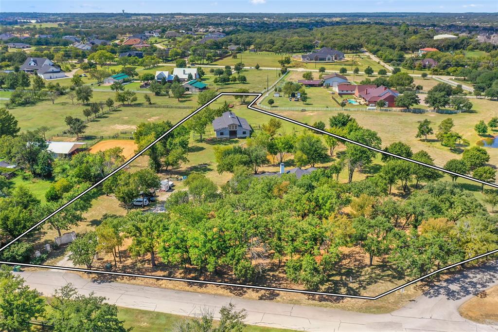 1082 Post Oak Road Copper Canyon, TX 76226 - Photo 2 of 40 an aerial view of residential houses with outdoor space and trees