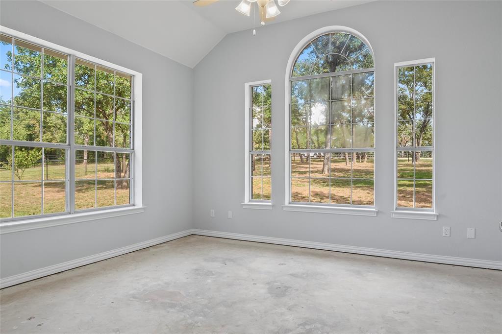1082 Post Oak Road Copper Canyon, TX 76226 - Photo 21 of 40 an empty room with a window