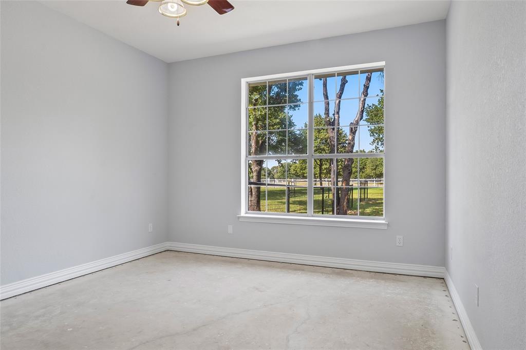 1082 Post Oak Road Copper Canyon, TX 76226 - Photo 23 of 40 an empty room with a window