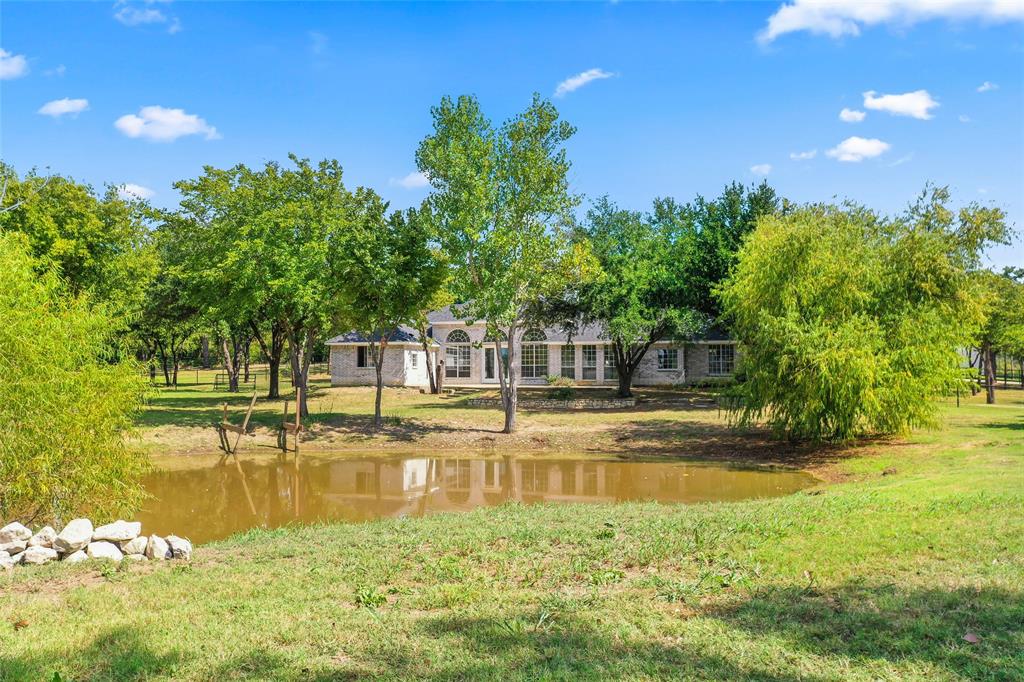 1082 Post Oak Road Copper Canyon, TX 76226 - Photo 25 of 40 a view of a swimming pool with an outdoor space and seating area