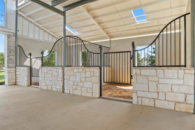 a view of a house with a yard and potted plants