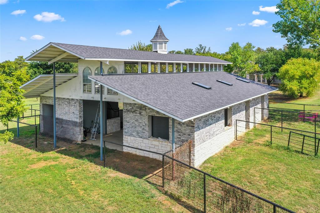 1082 Post Oak Road Copper Canyon, TX 76226 - Photo 32 of 40 a view of a house with a yard and potted plants