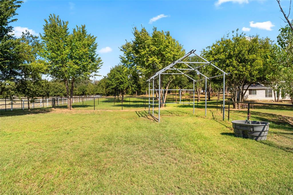 1082 Post Oak Road Copper Canyon, TX 76226 - Photo 37 of 40 a view of a swimming pool with an outdoor space and seating area