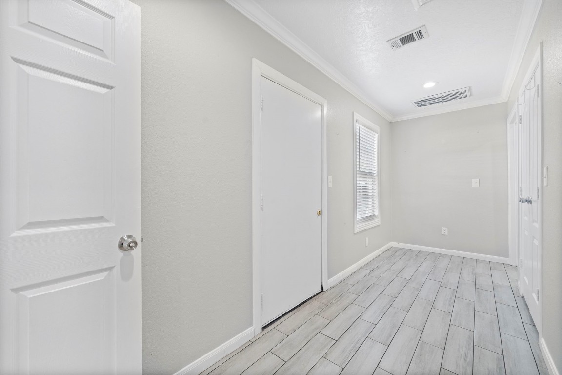 7941 Goode Street Houston, TX 77012 - Photo 11 of 26 a view of a hallway with wooden floor