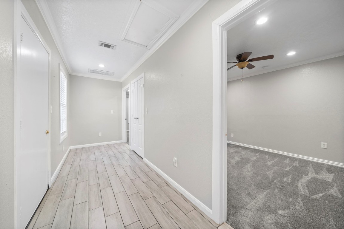 7941 Goode Street Houston, TX 77012 - Photo 12 of 26 a view of a hallway with wooden floor