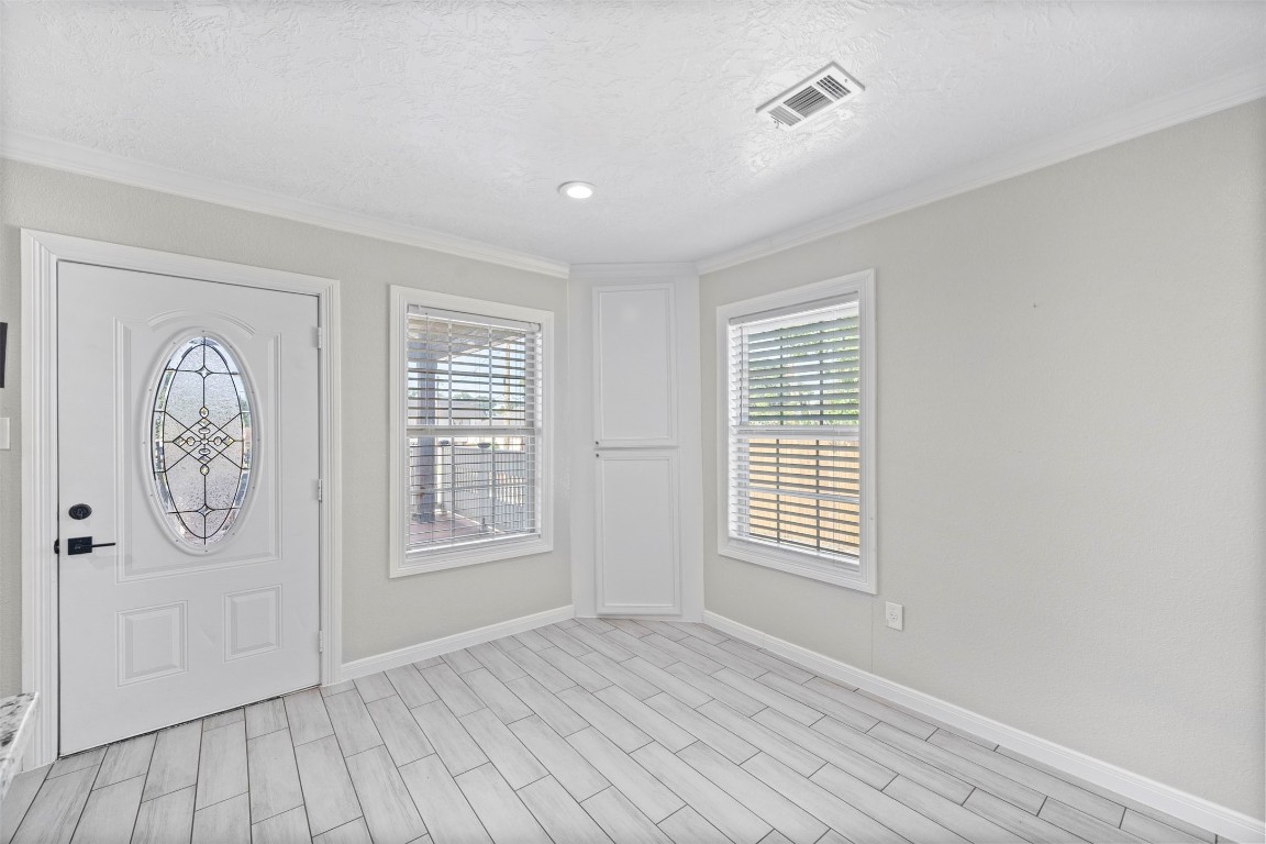 7941 Goode Street Houston, TX 77012 - Photo 18 of 26 wooden floor in an empty room with a window