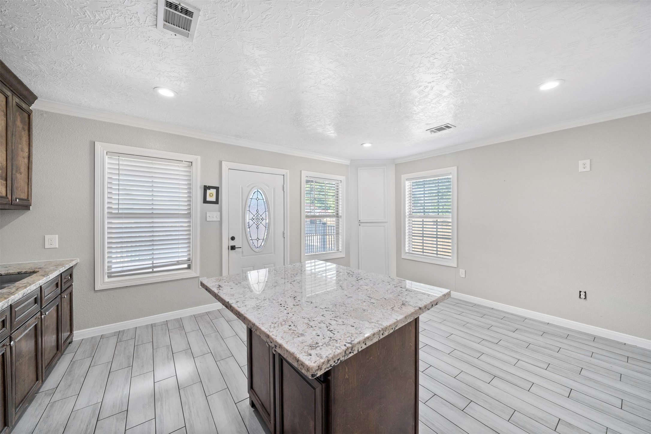 7941 Goode Street Houston, TX 77012 - Photo 23 of 26 an empty room with wooden floor and windows
