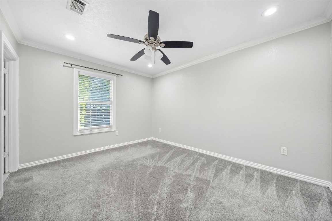 7941 Goode Street Houston, TX 77012 - Photo 6 of 26 an empty room with windows and fan