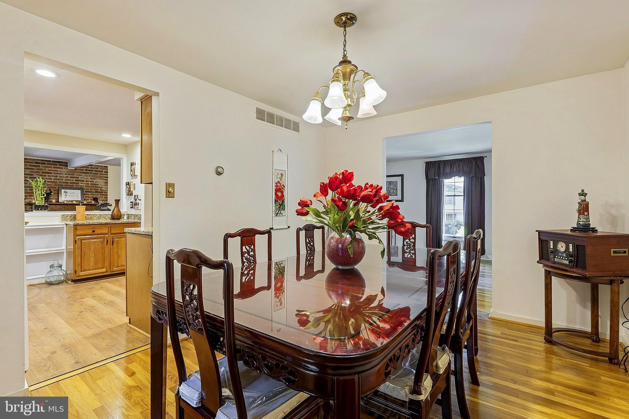 5210 Windmill Lane Columbia, MD 21044 - Photo 11 of 29 a view of a dining room with furniture and wooden floor
