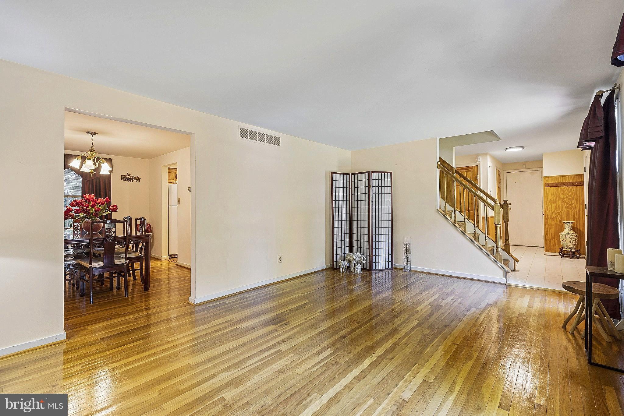 5210 Windmill Lane Columbia, MD 21044 - Photo 12 of 29 a view of a livingroom with wooden floor and furniture