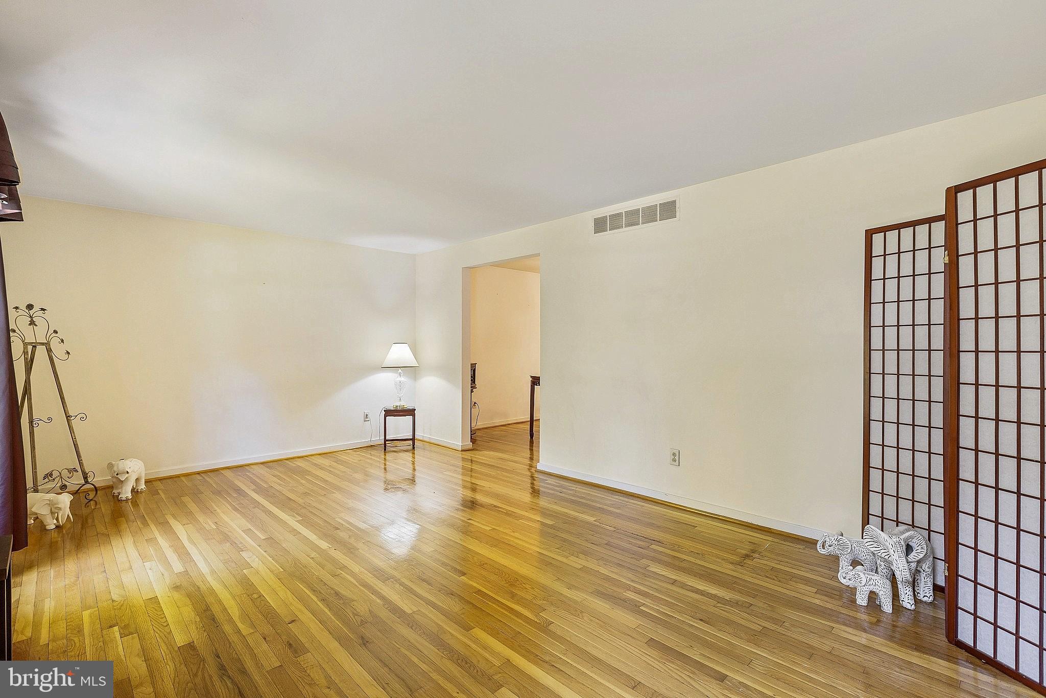 5210 Windmill Lane Columbia, MD 21044 - Photo 14 of 29 a view of empty room with wooden floor