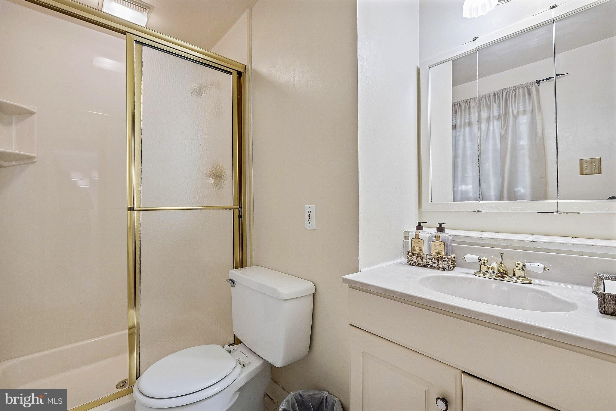 5210 Windmill Lane Columbia, MD 21044 - Photo 20 of 29 a bathroom with a sink a toilet and shower