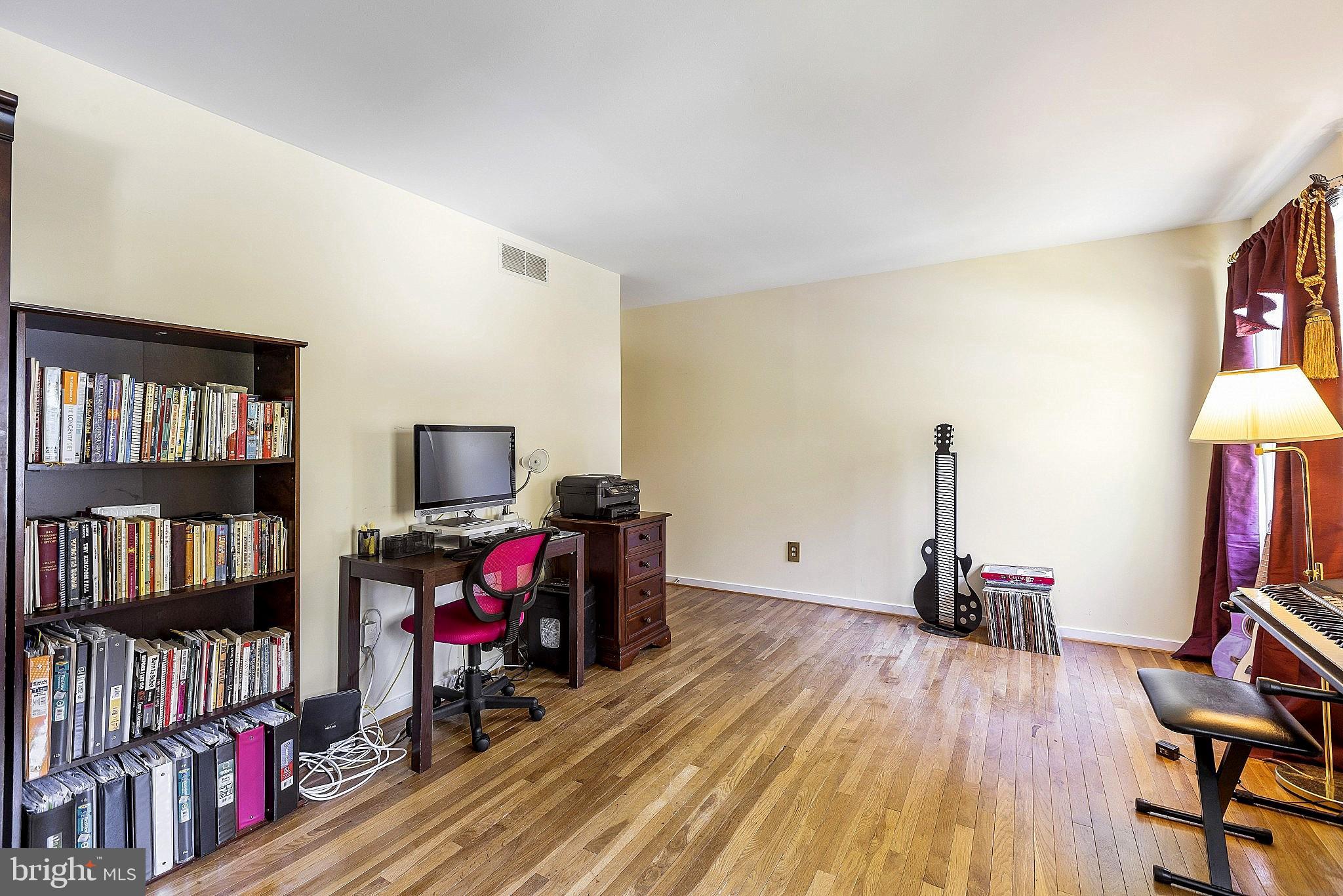 5210 Windmill Lane Columbia, MD 21044 - Photo 22 of 29 a view of a workspace with furniture and wooden floor