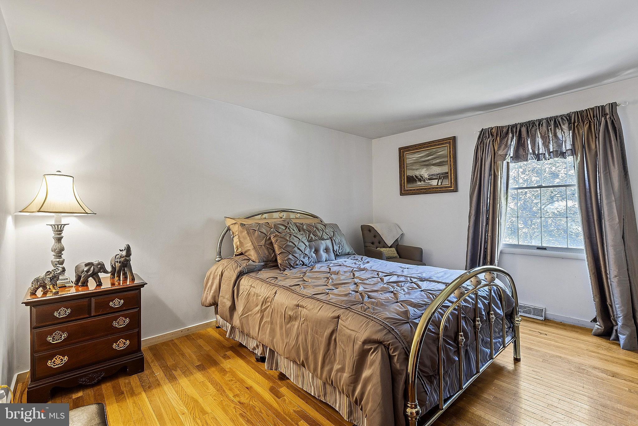 5210 Windmill Lane Columbia, MD 21044 - Photo 24 of 29 a bedroom with a bed and a window