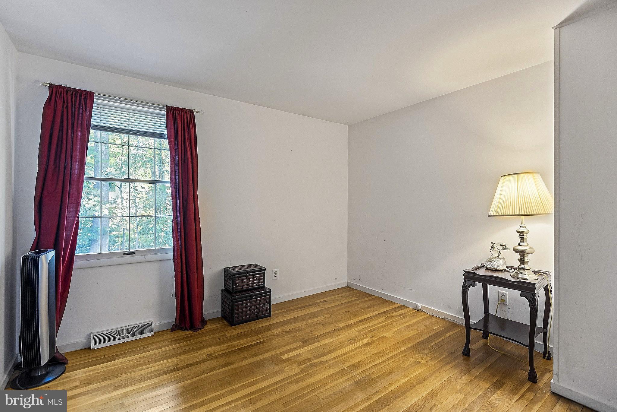 5210 Windmill Lane Columbia, MD 21044 - Photo 26 of 29 a view of a livingroom with wooden floor and a workspace
