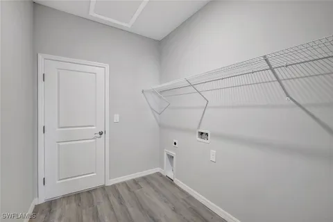 a view of a room with wooden floor