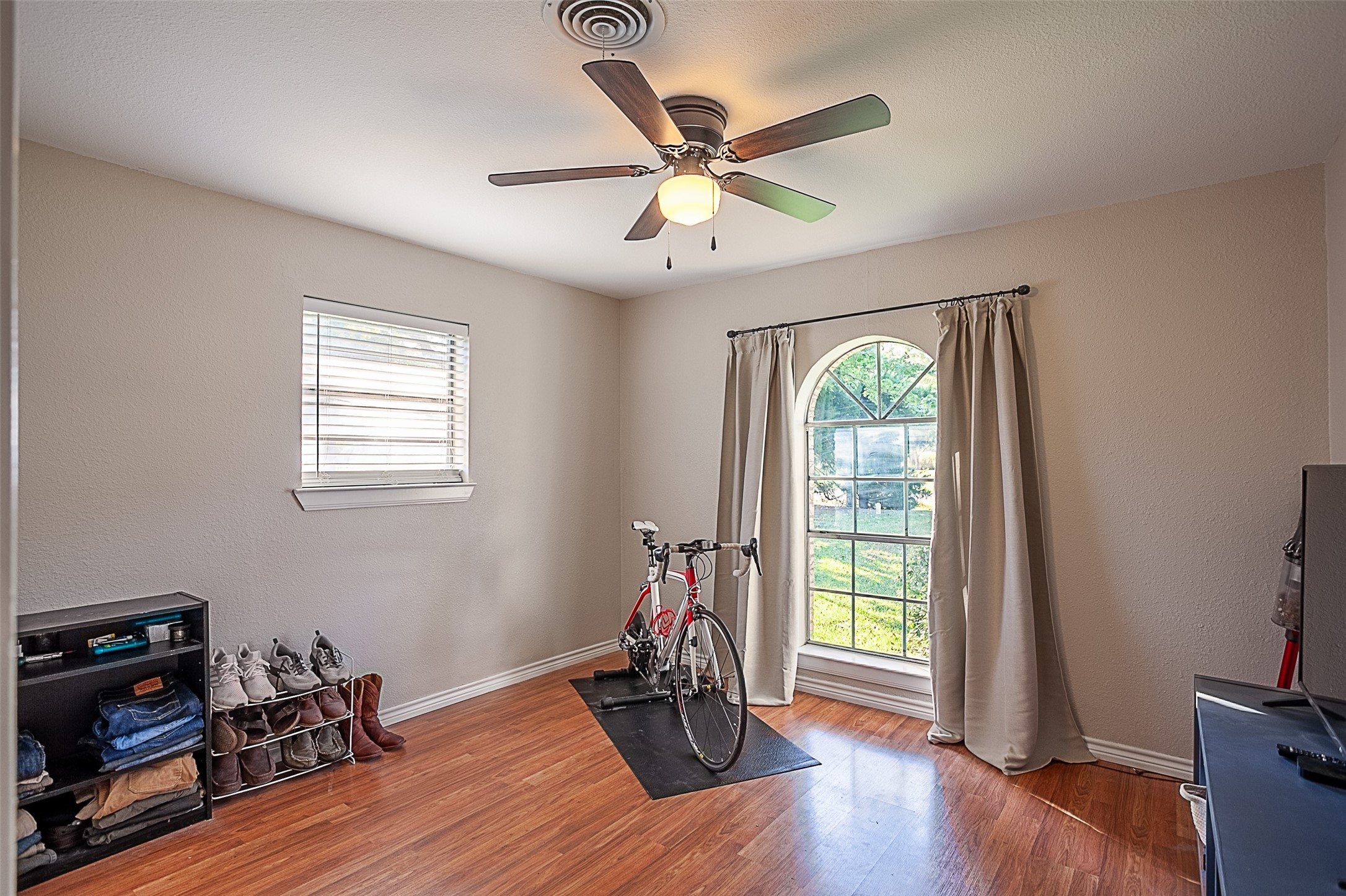 3381 Carpenter Road Orange, TX 77630 - Photo 15 of 29 a room with wooden floor chandelier fan and windows