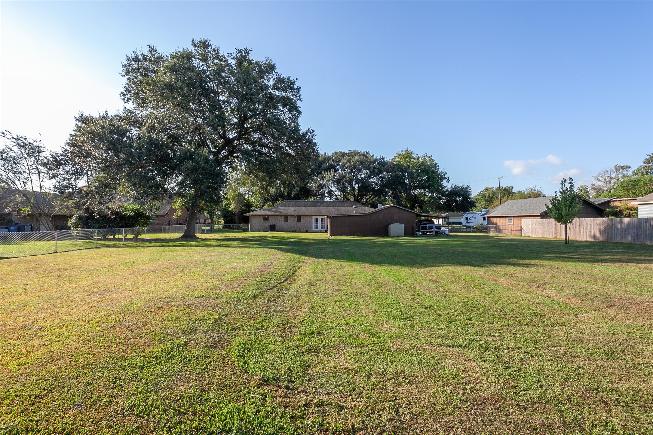 3381 Carpenter Road Orange, TX 77630 - Photo 23 of 29 a view of building with swimming pool and green space