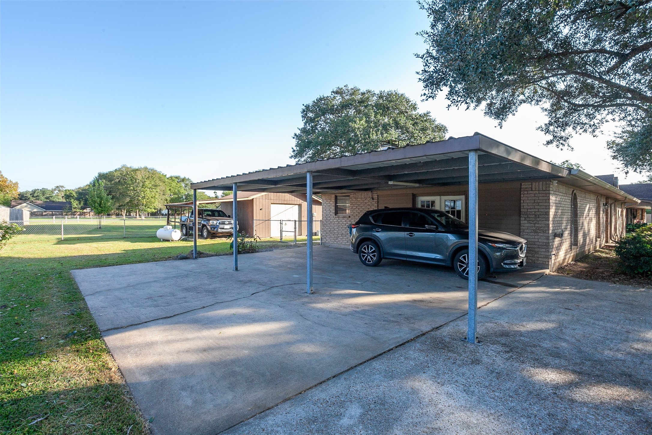 3381 Carpenter Road Orange, TX 77630 - Photo 28 of 29 a view of a car parked in back yard of a house