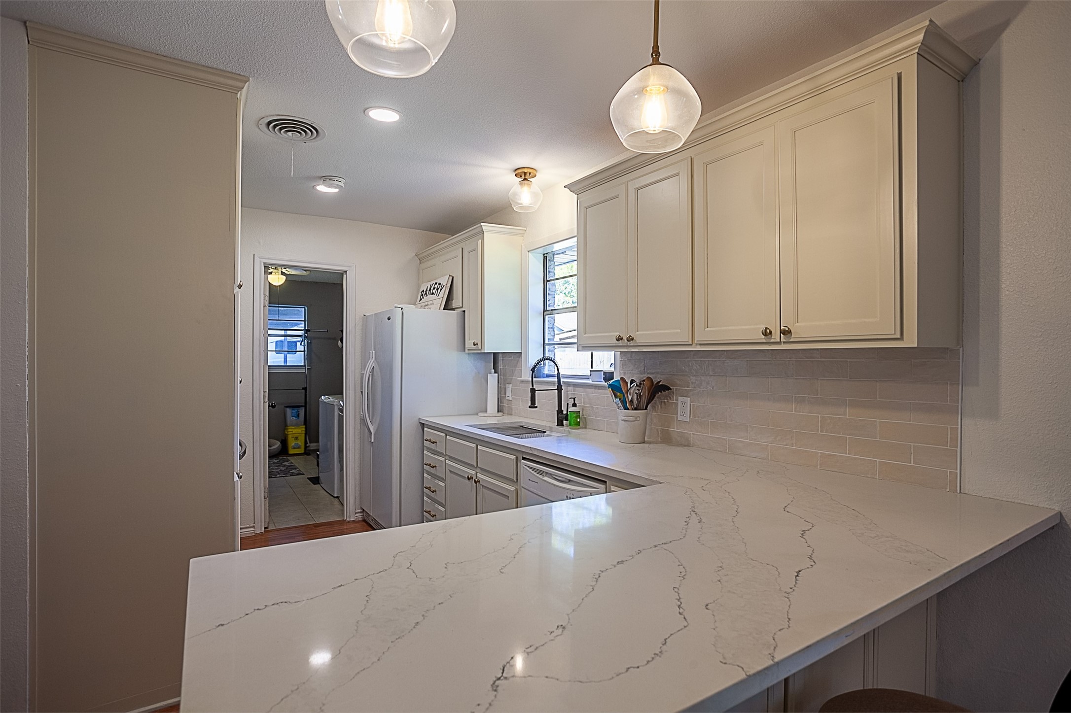 3381 Carpenter Road Orange, TX 77630 - Photo 8 of 29 a view of a kitchen with kitchen island a sink stainless steel appliances and cabinets