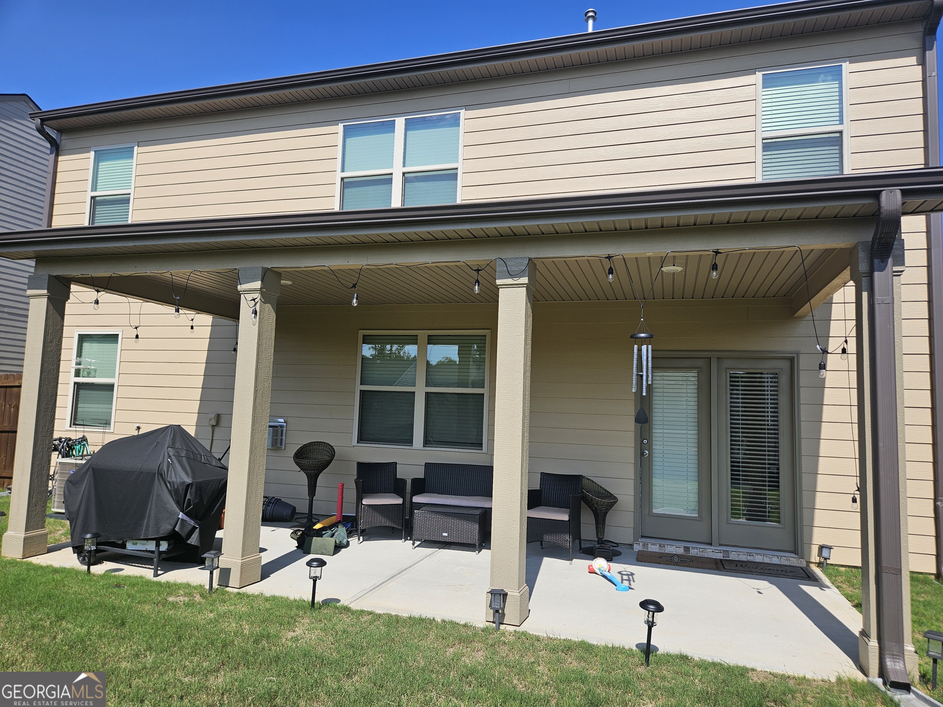 5454 Flat Rock Point Lithonia, GA 30038 - Photo 22 of 24 a view of a house with patio and yard