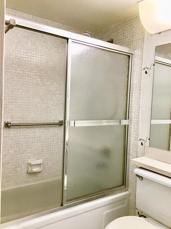 204 Preston Way, Unit 204 Boca Raton, FL 33434 - Photo 19 of 31 a bathroom with a shower and a toilet